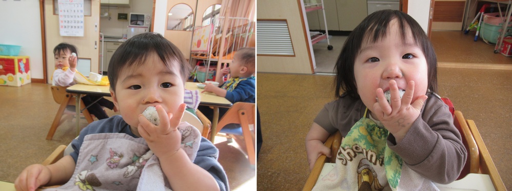 子どもがおにぎりを食べている１